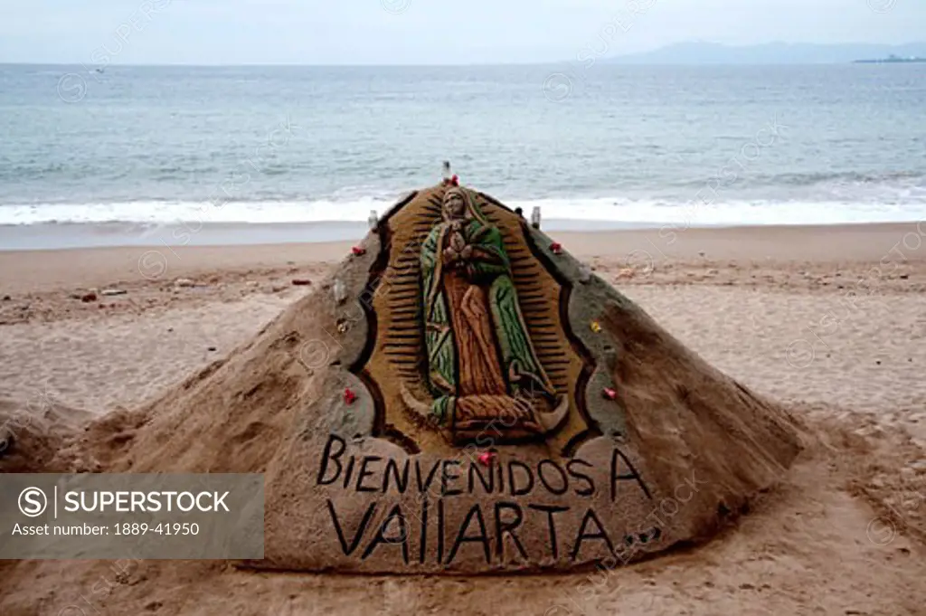 Welcome sign made from sand on beach; Puerto Vallarta, Mexico