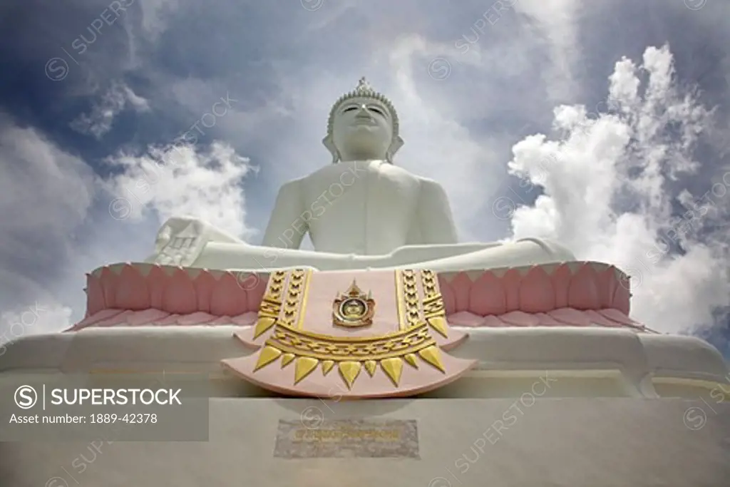 Phra Buddhasurintaramongkol, Isan, Thailand; Low angle view of Buddha and temple