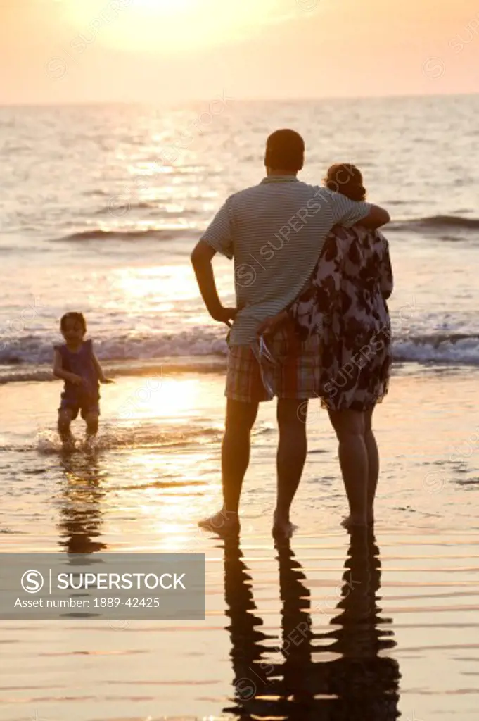 Puerto Vallarta, Mexico; Family on beach at sunset