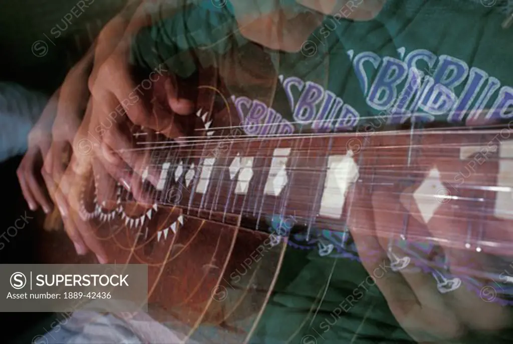 Multi-layered picture of a guitar player