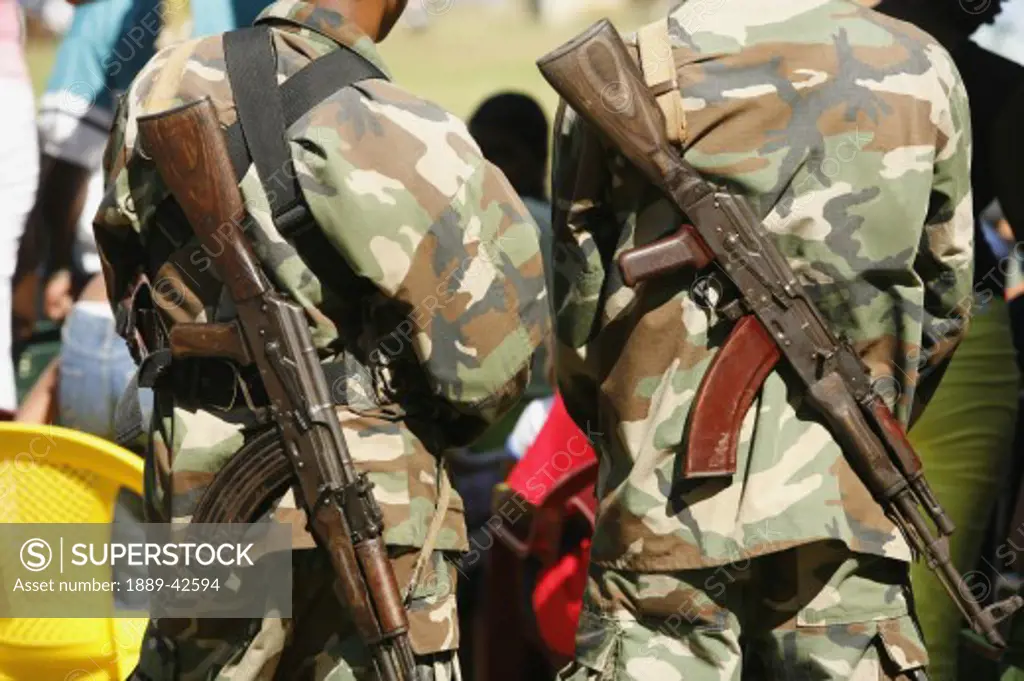 Tasbapauni, Nicaragua; Guns strapped to soldiers backs