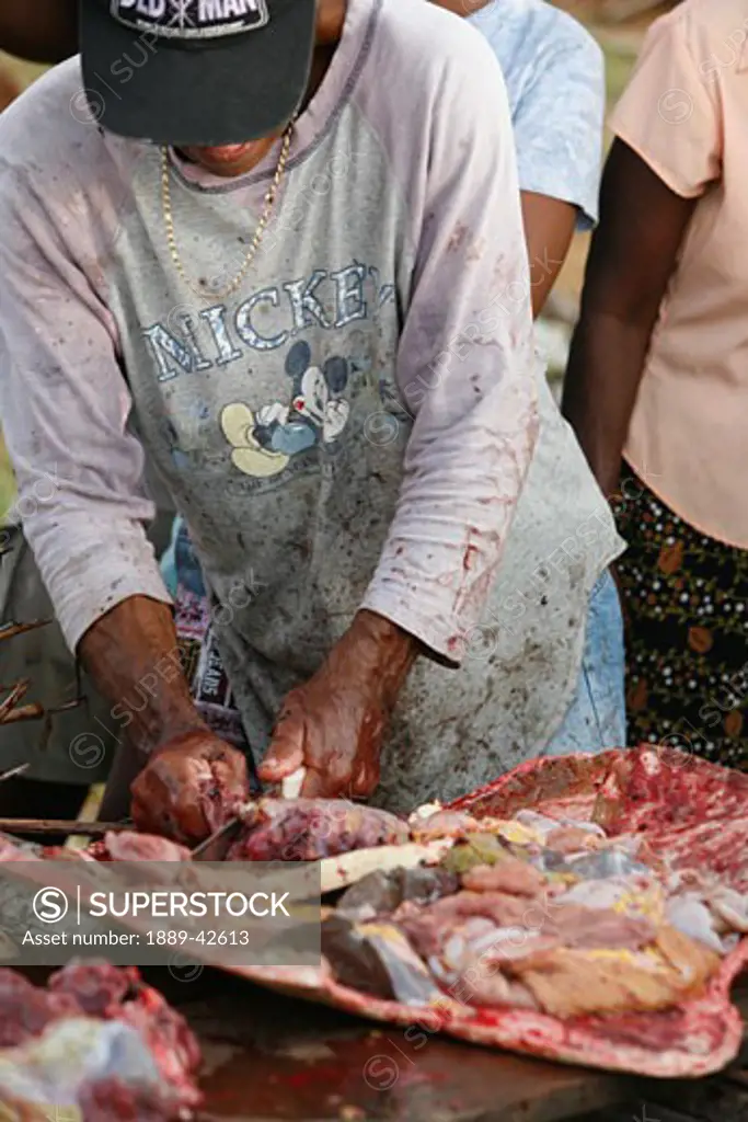 Tasbapauni, Nicaragua; Butcher cutting turtle meat