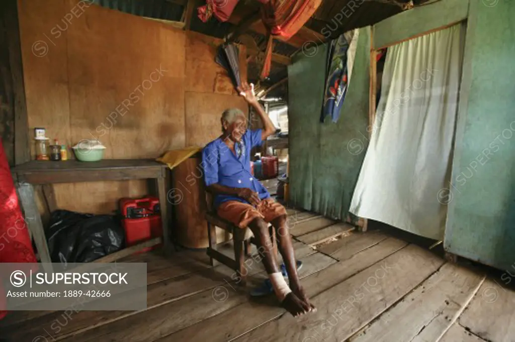 Tasbapauni, Nicaragua; Woman sitting in house