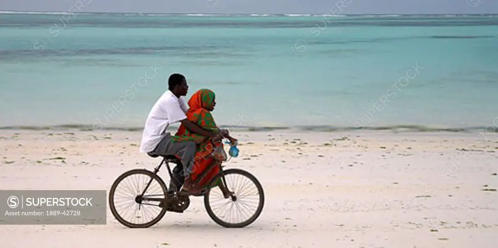 Zanzibar, Tanzania; Cycling on the beach