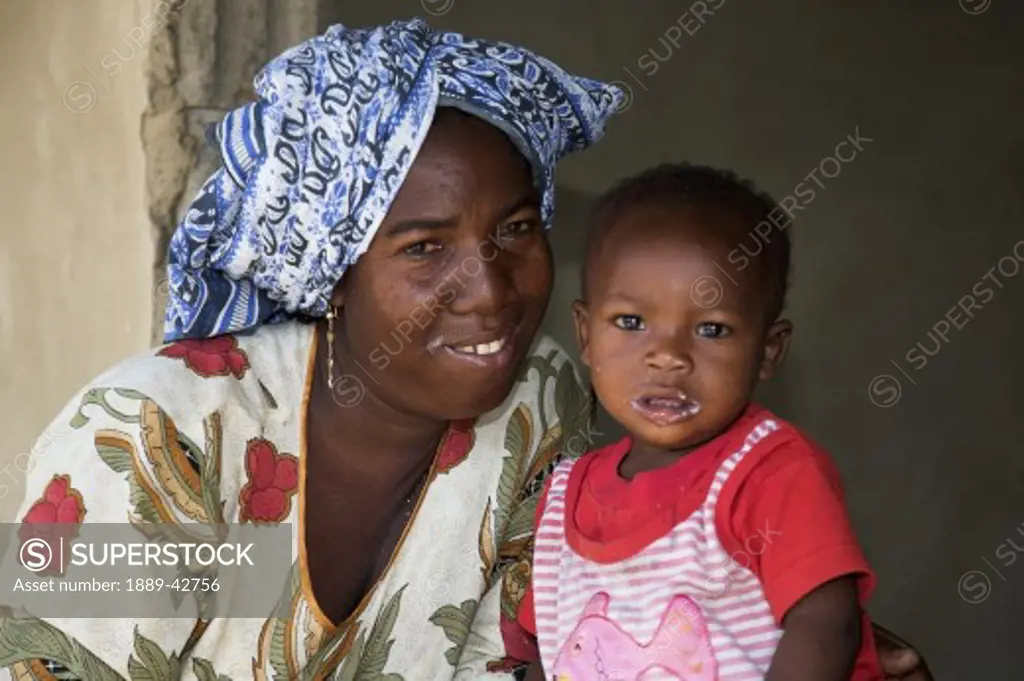 Zanzibar, Tanzania; Mother and child looking at camera