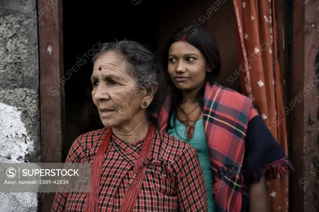 Pokhara, Nepal; Women exiting house