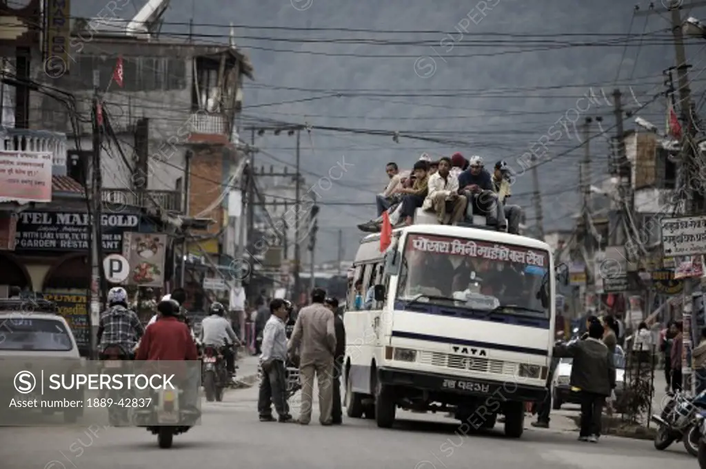 Lakeside District, Pokhara, Nepal; Bus laden with people