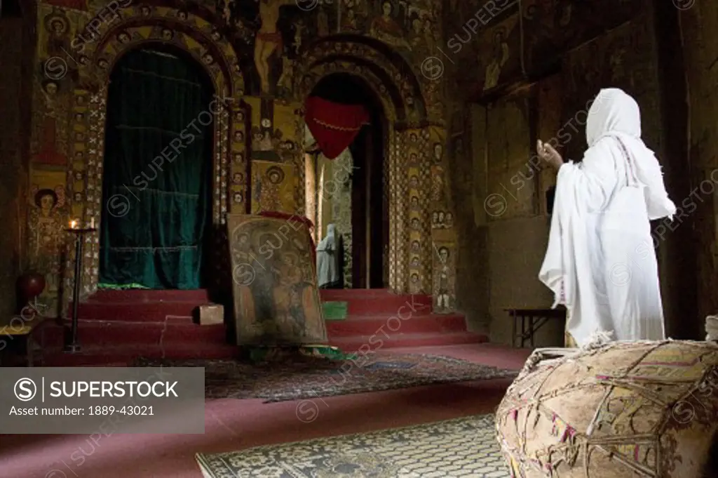 Ethiopia; Woman praying inside church