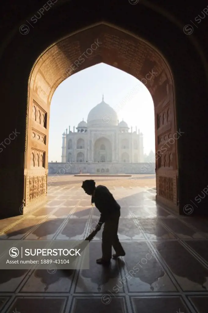 Taj Mahal, Agra, India; Person sweeping in front of Taj Mahal