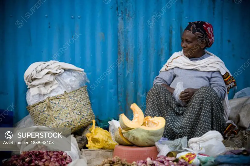 Ethiopia; Woman selling vegetables in market