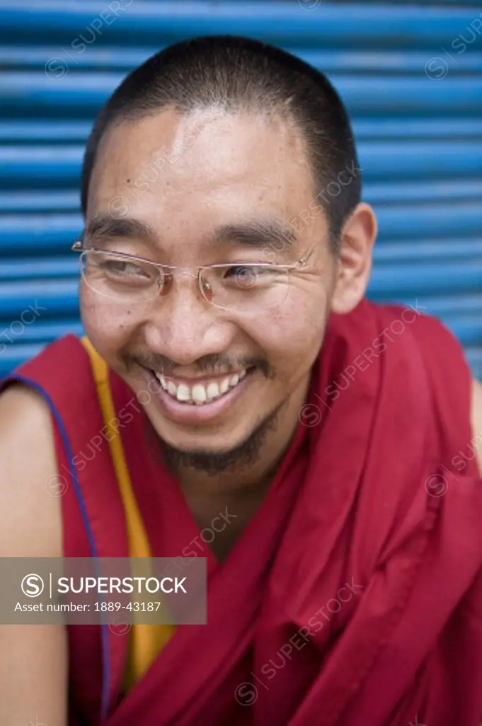 Boudhnath, Kathmandu, Nepal; Portrait of man laughing