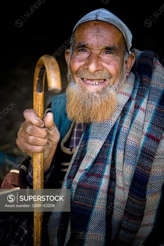 Lidderwat, Kashmir, India; Senior man smiling at camera