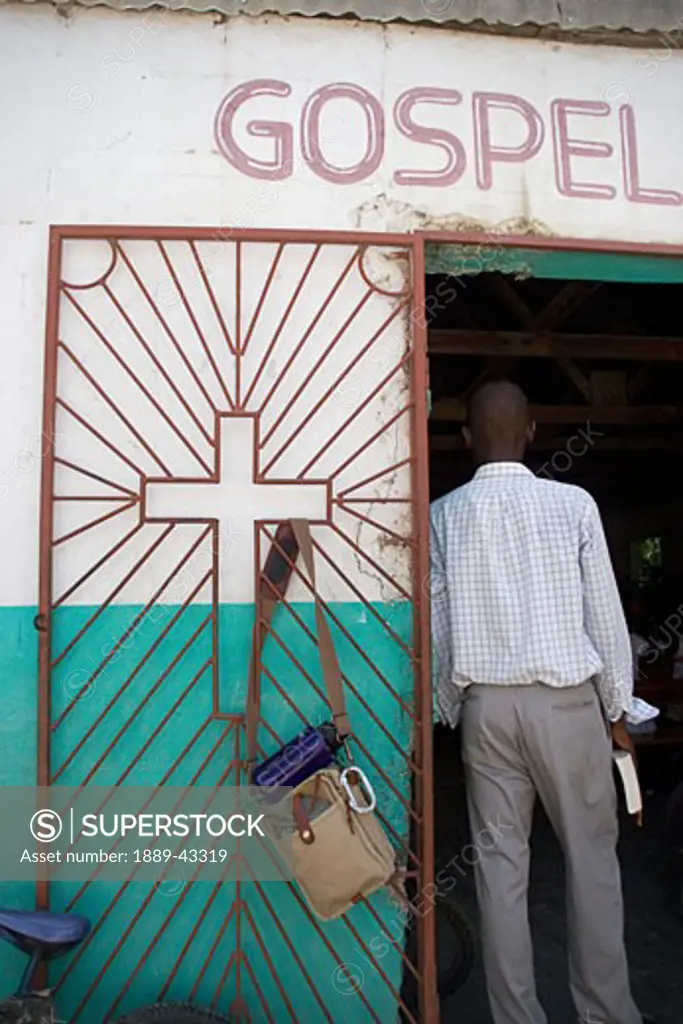 Haiti; Man standing in church doorway