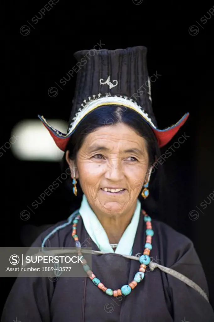 Ladakh, Jammu and Kashmir, India; Portrait of woman in traditional clothing
