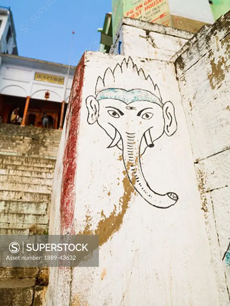 The Ganges,Varanasi,India;Mural of elephant on a wall by the ghats which lead to the river