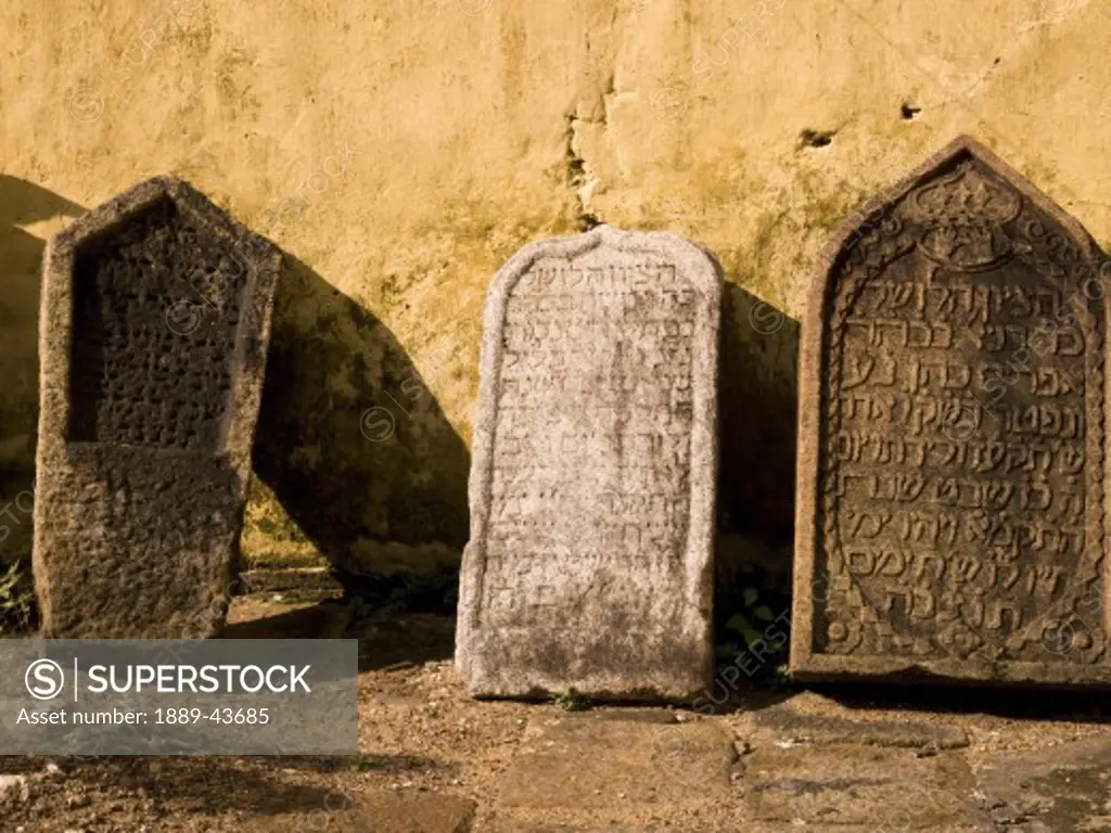 Jewtown,Cochin,India;Gravestones leaning against synagogue wall