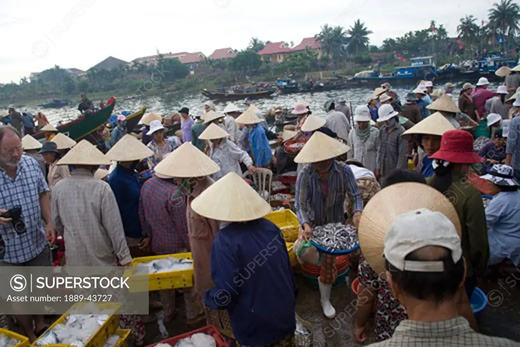 Hoi An,Vietnam;Vendors selling at an open air market 