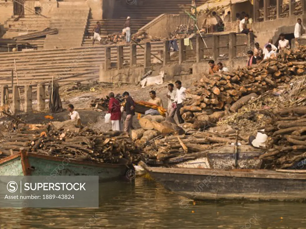 The Ganges,Varanasi,India;Boats full of timber in the river