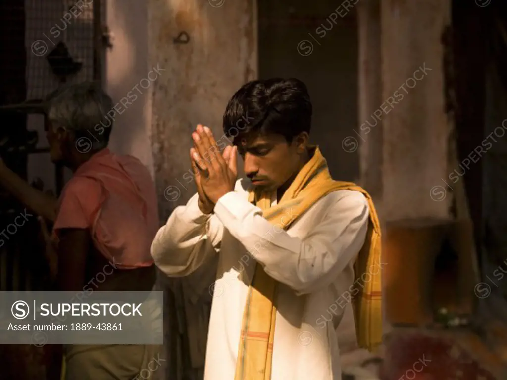 Varanasi,India;Man praying in temple