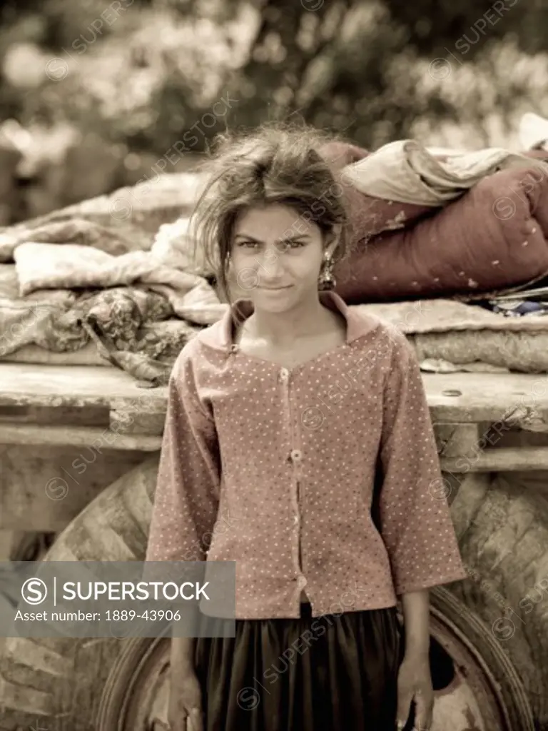 India;Portrait of young Indian gypsy girl,sitting by her cart