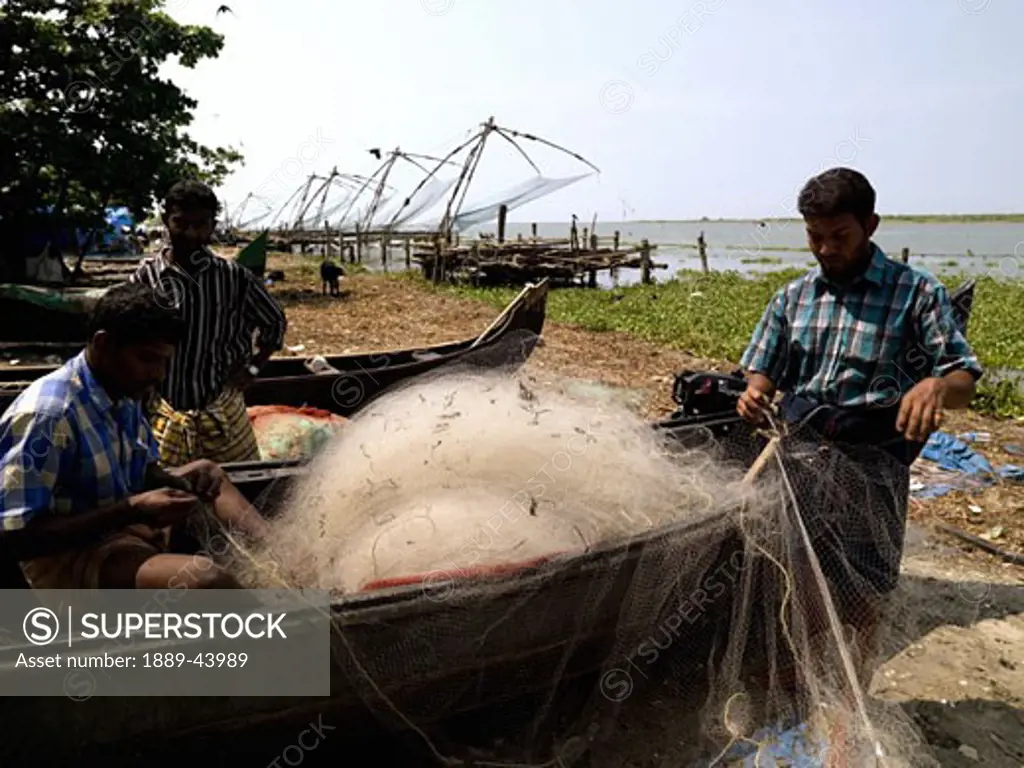 Arabian Sea,Kerala,India;Fishermen checking their nets