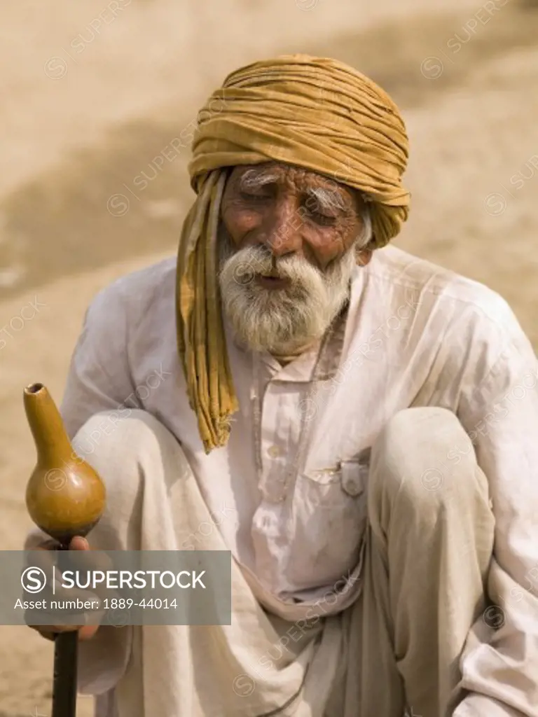 Agra,India;Senior man with hookah pipe