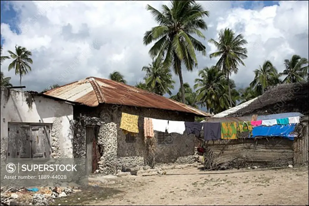 Pwani Mchangani,Zanzibar,Africa;Village scene,huts and washing on the line