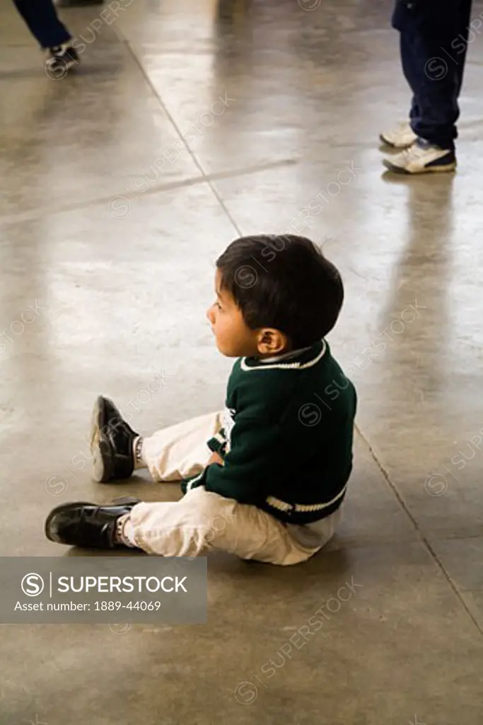 Guatemala;Young boy sitting on the ground,,