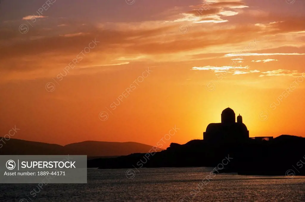 Greece, Silhouetted buildings near the water