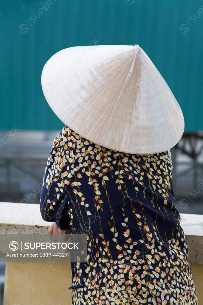 Woman outdoors leaning on railing in Vietnam