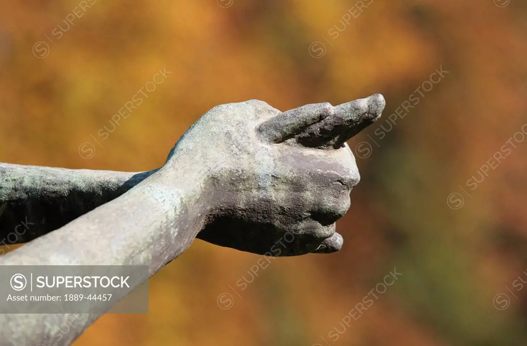 The hands of a stone statue
