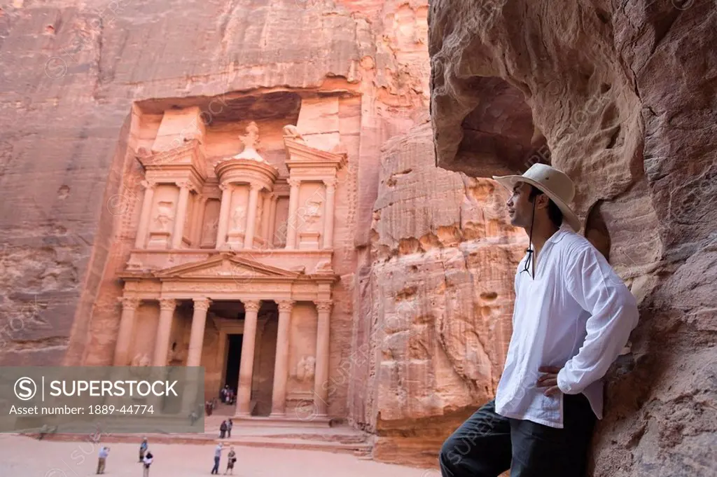 A man standing near Al Khazneh in Petra