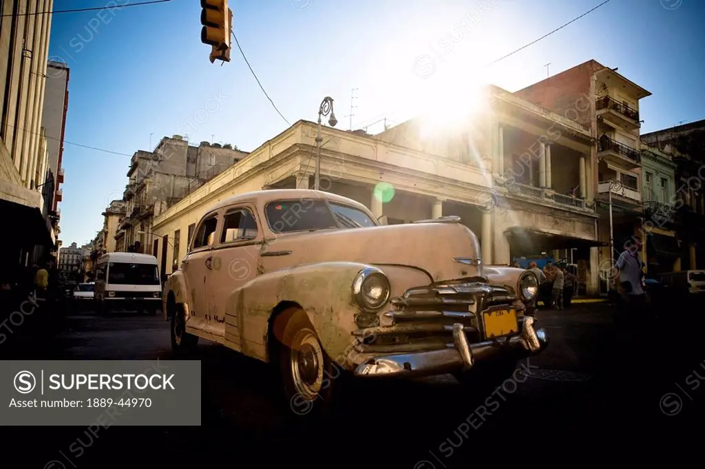 Cars passing through intersection in Havana