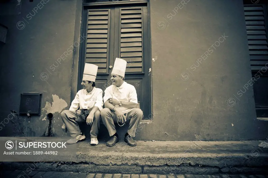Two cooks taking a break outdoors