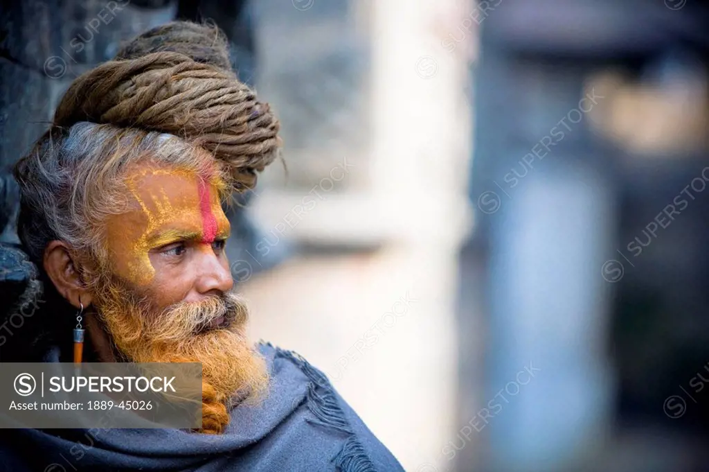 Man outdoors with face paint in Nepal