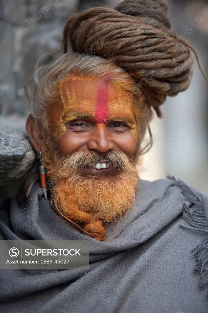 Man outdoors with face paint in Nepal