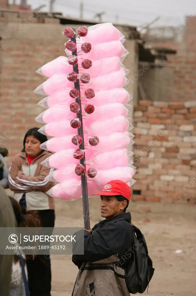 Candy floss and candy apple vendor, Lima, Peru