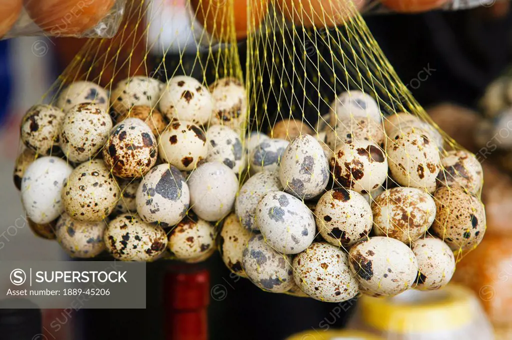 Speckled eggs in netting, Lima, Peru
