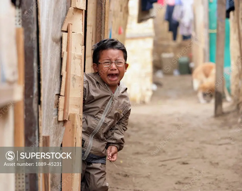 Young boy crying, Lima, Peru