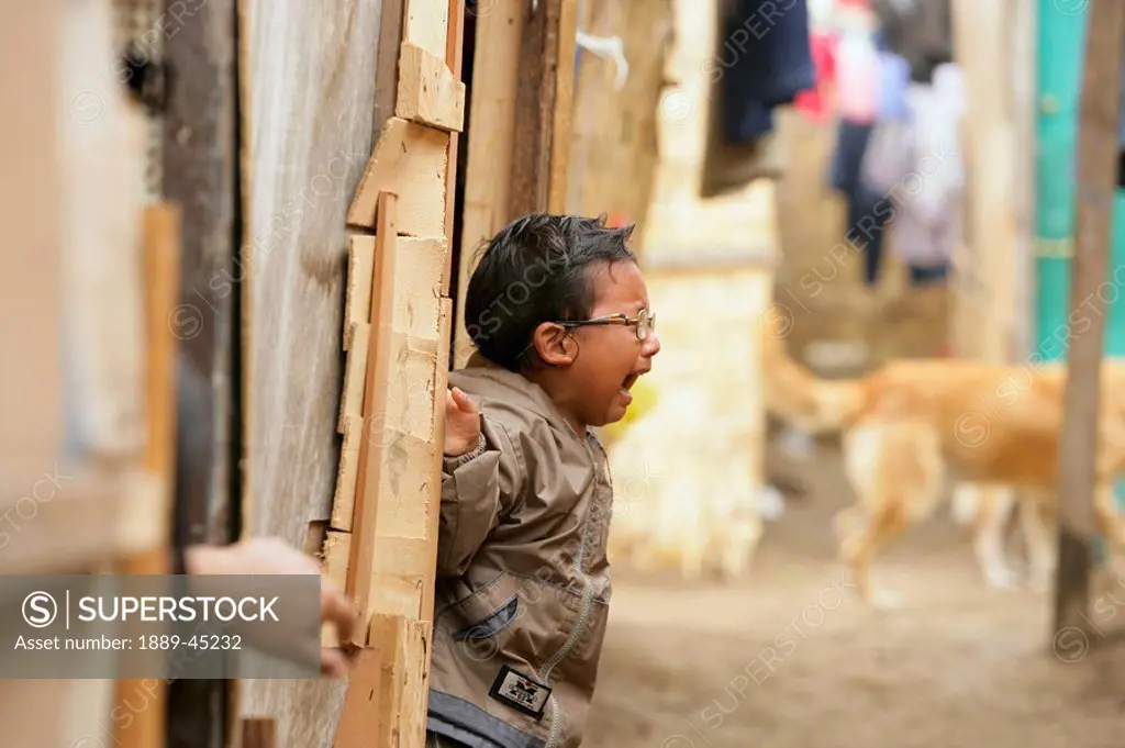 Young boy crying, Lima, Peru