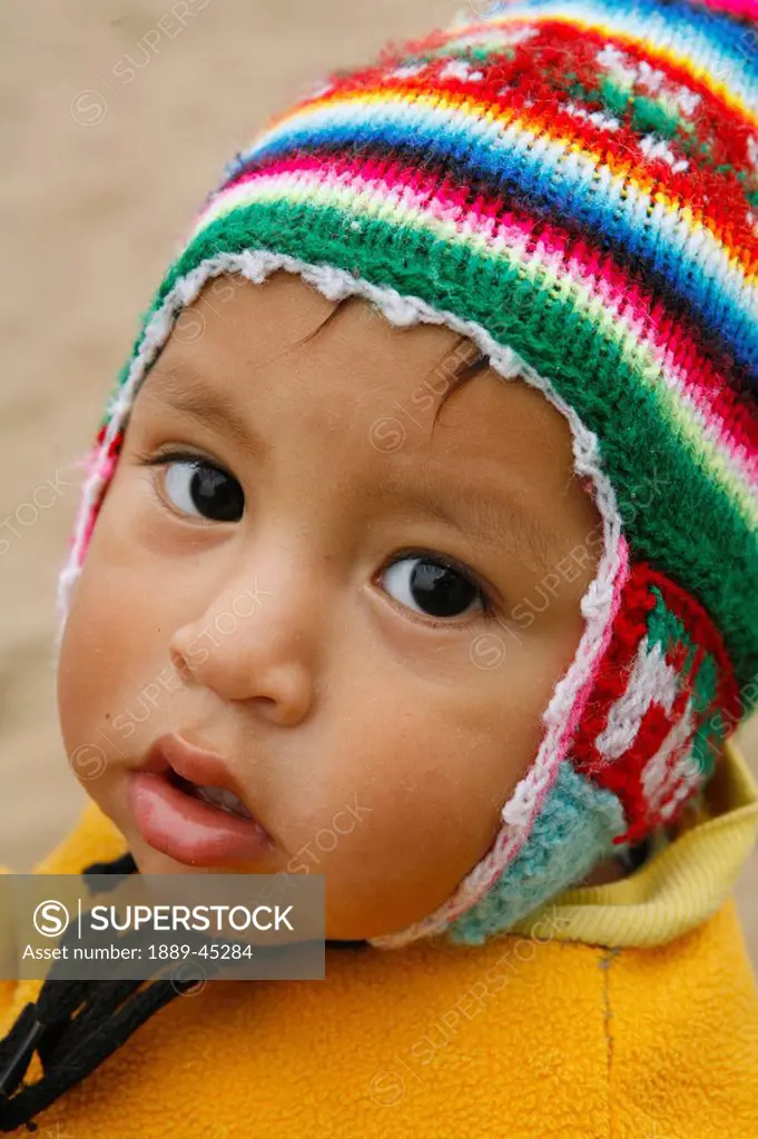 Young child in wool cap, Lima, Peru
