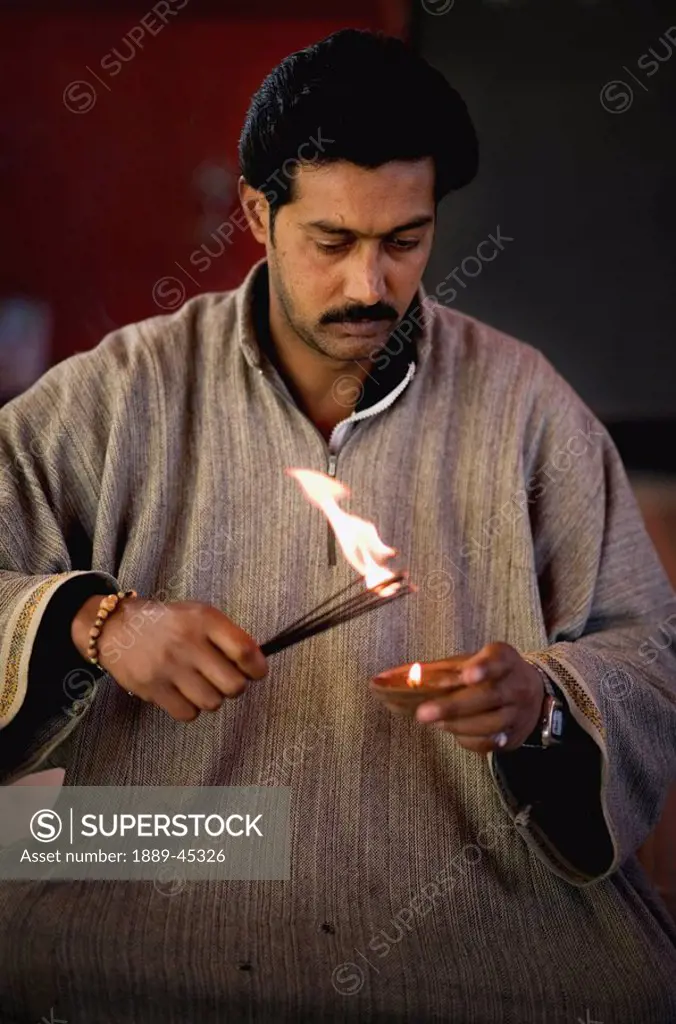 Man burning incense