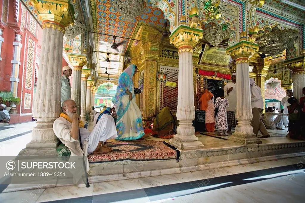 People in an ornate building