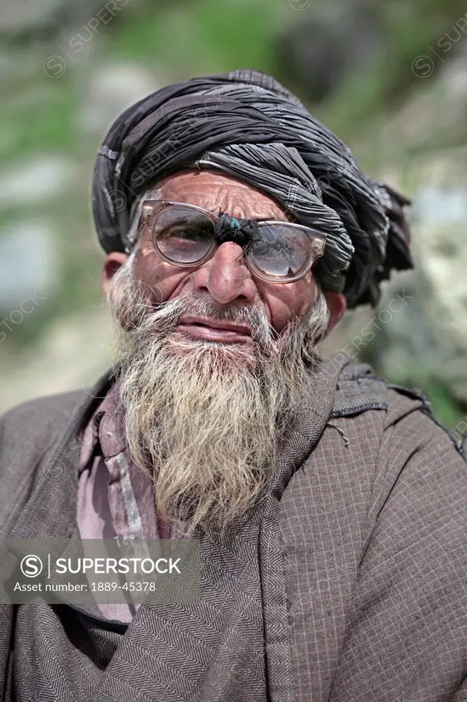 Senior man in turban and large eyeglasses