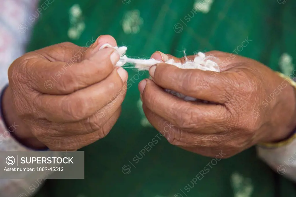 Woman´s hands spinning wool, Pokhara, Nepal