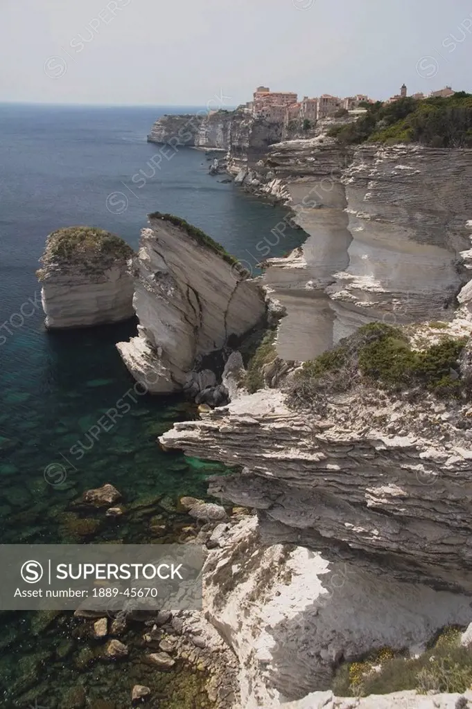 bonifacio, corsica, france, white cliffs and rock formations along the coastline