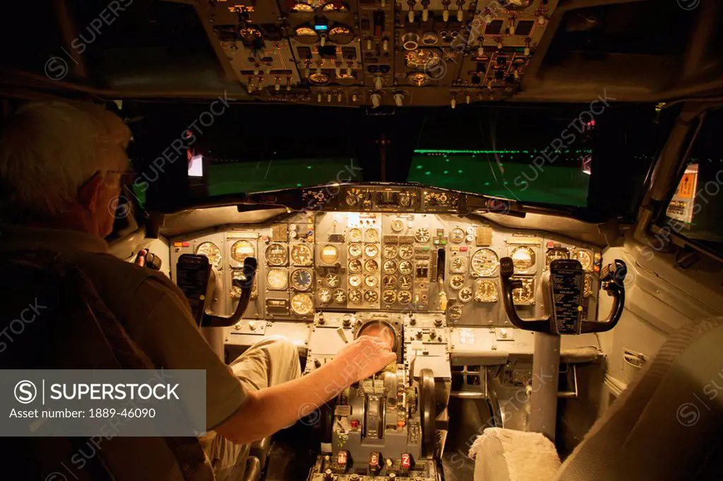 a pilot in the cockpit of an airplane