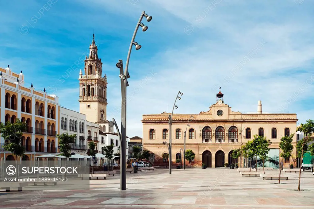 ecija, sevilla, spain, la plaza de espa±a with the town hall and the tower of the iglesia de santa maria in background