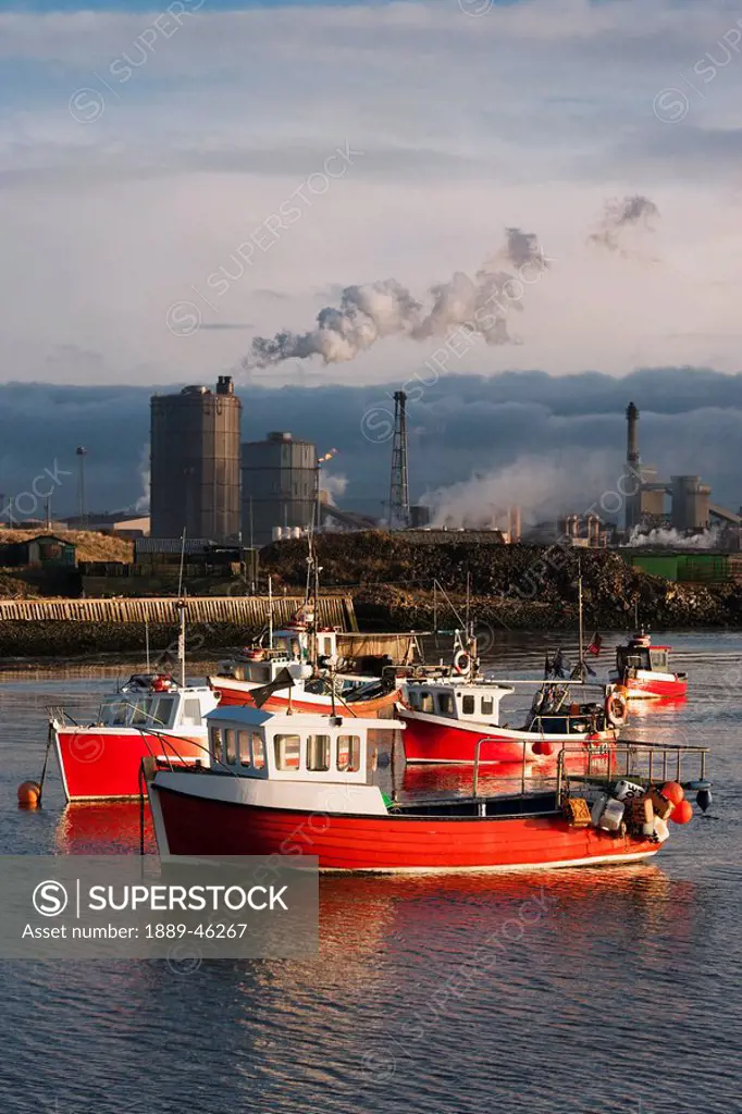 saltburn, teesside, england, boats moored in the water and an industrial area in the background
