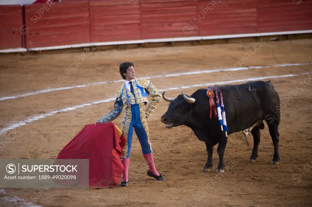 At a bullfight in Mexico City, a Matador demonstrates his courage; Mexico City, Mexico